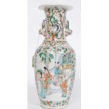 A 19th century Chinese famille rose vase with court scenes to the panels having fu dog and