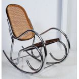 A vintage 1970's retro chrome and bergere rocking chair,