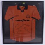 A Wolverhapton Wanderers ( Wolves ) signed football shirt being framed and glazed