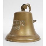 A decorative 20th century reproduction brass bell inscribed Titanic 1912.
