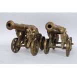A pair of large heavy matching desk cannons, with scrolling dragon design support,