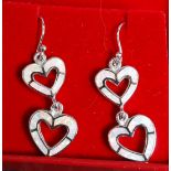 A pair of silver and enamel set double heart drop earrings. Stamped 925.