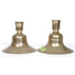 A near pair of Islamic brass candlestick