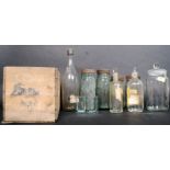 A collection of glassware to include vintage bottles,