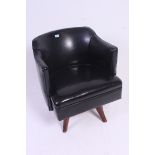 A 20th century black faux leather office swivel desk chair.