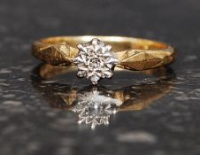 An 18ct hallmarked gold ring set with a single 2pt diamond. Weight 3g. Size K.5.
