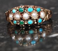 A Victorian 9ct gold ring set with seed pearls and turquoise within a frilly mount the sides being
