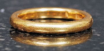 A 22ct gold hallmarked gold band ring. Weight 5.3. Size K.