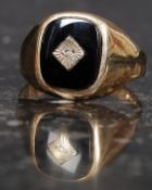 A gentlemans 9ct gold, diamond and black onyx signet ring. The central stone approx 1pnt.