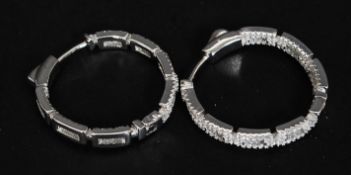 A pair of large silver and cz stone hoop earrings of linked bar design. 11.