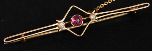 An early 20th century Art Nouveau 9ct gold seed pearl and amethyst set bar brooch with pin and