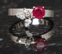 A ladies 14ct white gold ruby and diamond ring.