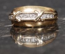 A 9ct gold hallmarked ring set with 10 x 1pt diamonds with a twin cross motif. Size L. 3.
