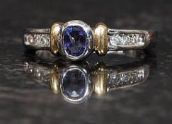 A ladies 14ct white gold sapphire and diamond ring,