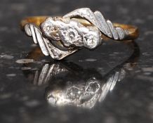 An Art Deco 18ct gold and platinum ring marked 780 set with 3 diamonds approx 4pts. Weight  2.7g.