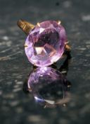 A 9ct gold dress ring set with a large amethyst.  Weight 3.1g.
