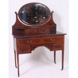 aN Edwardian mahogany dressing table with inlay.