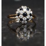 A 9ct gold hallmarked ring with CZ and Sapphire cluster. Weight 2g.