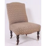 A late Victorian Nursing Chair.- armchair raised on turned legs with overstuffed seat and back rest.