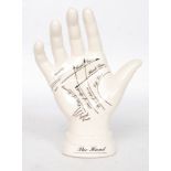 A `Palmistry` ceramic hand for instruction purposes.
