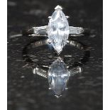 A silver ladies 925 stamped dress ring with central marquise CZ stone and baquette stone CZ