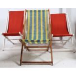 A collection of 4 mid century folding deck chairs with canvas centres,