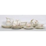 A thirty piece 19th century Victorian china tea service in a floral chintzy finish to include eight