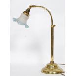 A good brass bankers lamp raised on angular stem with terraced base having frosted blue glass shade