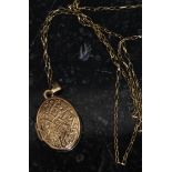 A 9ct gold locket and necklace. The lozenge shaped locket being decorated with celtic knot design.
