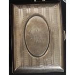 A silver hallmarked cigarette case with monogram to cartouche.