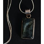 A ladies silver lozenge pendant with inset Labradorite stone set to a silver snake fine chain.