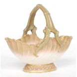 A Royal Worcester Ivory Blush bon bon dish basket of scalloped form with handle.