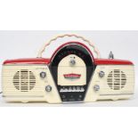 A Bush Radio cassette player The Overdrive model based on a 1950's car dash board in red and cream