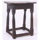 A believed 17th Century Oak Joint Stool. The plank top above a geometric carved frieze.