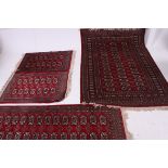 A collection of matching floor rugs / carpets of various sizes,