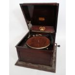 A vintage Columbia cased tabletop portable gramophone, with makers label to inside lid.