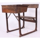 A vintage early 20th century cast iron and oak school desk.