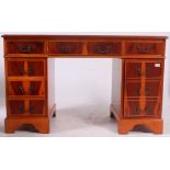 An Antique Georgian style yew wood twin pedestal desk.