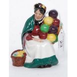 A Royal Doulton Miniature Figurine entitled ' The Old Balloon Seller ' model number HN2129 with