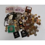 A collection of coins from around the world to include British,