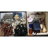 A collection of costume jewellery to include brooches, necklaces,