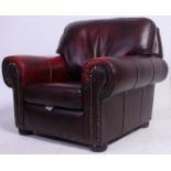 A Victorian style chesterfield armchair in oxblood red leather having studded edge details.