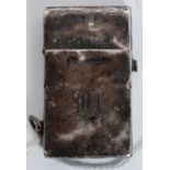 A sterling silver petrol lighter, having hinged lid with lighting mechanism built into the lid.