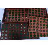 A pair of mahogany cased coin boxes dating to the early - mid 20th century  having inset coin trays