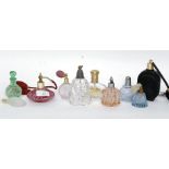 A collection of twelve vintage and later perfume bottles to include cut glass, coloured glass,