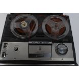 A Grundig De Luxe reel to reel retro vintage tape player.