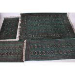 A collection of matching floor rugs / carpets of various sizes,