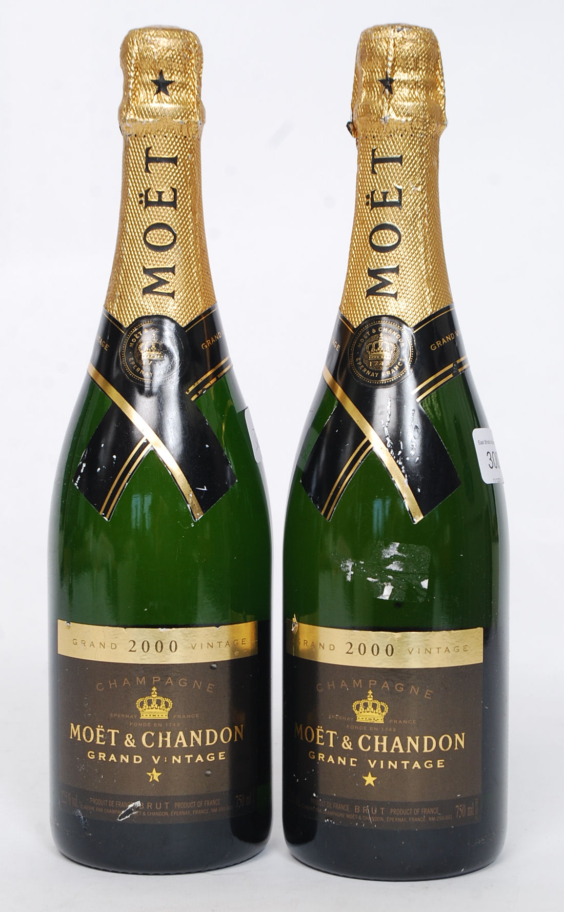 2 vintage Moet & Chadon bottles of champagne 2000 ( see illustrations )