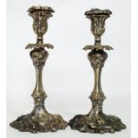 A pair of 20th century Art Nouveau style brass and plate candlesticks,