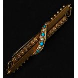 A 15ct Victorian bar brooch set with a seed pearl and turquoise swag. Marked 15ct 625.
